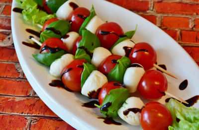 Caprese skewers with balsamic glaze and basil oil